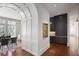 View of the open-concept dining area, butler's pantry and entry, hardwood floors, and high ceilings at 3364 Knollwood Nw Dr, Atlanta, GA 30305