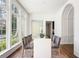 Light-filled dining room with large windows, hardwood floors, and seating for eight at 3364 Knollwood Nw Dr, Atlanta, GA 30305