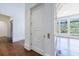 Hallway view featuring a decorative elevator door and an adjacent sunlit room with large windows at 3364 Knollwood Nw Dr, Atlanta, GA 30305