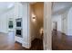 Bright hallway featuring a convenient built-in oven and access to an under-stairs storage space, enhancing functionality at 3364 Knollwood Nw Dr, Atlanta, GA 30305