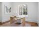 Home office with a desk, rug, and natural light at 3364 Knollwood Nw Dr, Atlanta, GA 30305