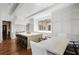 Well-equipped kitchen with central island, bar seating, and a sunlit dining area at 3364 Knollwood Nw Dr, Atlanta, GA 30305
