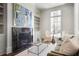 Cozy living room with a marble fireplace, natural light, and comfortable seating, ideal for relaxation and gatherings at 3364 Knollwood Nw Dr, Atlanta, GA 30305