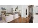 Elegant living room with a fireplace and seamless transition to kitchen at 3364 Knollwood Nw Dr, Atlanta, GA 30305