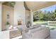 Relaxing outdoor patio with fireplace, comfortable seating, and a refreshing pool view at 3364 Knollwood Nw Dr, Atlanta, GA 30305