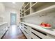 Well-organized pantry with marble countertops, custom shelving, and ample storage space for all your culinary needs at 3364 Knollwood Nw Dr, Atlanta, GA 30305