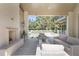 Spacious covered patio with fireplace, outdoor seating, overlooking the pool and lush backyard at 3364 Knollwood Nw Dr, Atlanta, GA 30305