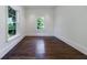 Unfurnished room with hardwood floors and natural light from large windows at 3364 Knollwood Nw Dr, Atlanta, GA 30305