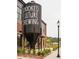 Exterior shot of Crooked Culture Brewing with distinctive grain silo at 655 Summit Hill Way, Cumming, GA 30040
