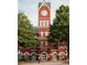 Historic Cumming City Hall featuring red brick architecture, clock tower and lush green trees at 655 Summit Hill Way, Cumming, GA 30040