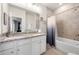 Bathroom with granite countertops and a bathtub with shower at 82 Rising Fawn Ln, Marietta, GA 30060