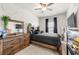 Inviting bedroom featuring a wooden dresser and decorative wall accents at 82 Rising Fawn Ln, Marietta, GA 30060