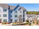 New construction townhouse with blue and gray siding, manicured landscaping, and inviting curb appeal at 82 Rising Fawn Ln, Marietta, GA 30060