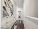 Hallway with hardwood flooring and contemporary artwork at 82 Rising Fawn Ln, Marietta, GA 30060