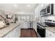 Bright kitchen with stainless steel appliances, granite countertops, and stylish backsplash at 82 Rising Fawn Ln, Marietta, GA 30060