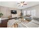 Bright living room boasts hardwood floors, contemporary furnishings, and elegant wall accents at 82 Rising Fawn Ln, Marietta, GA 30060