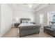 Relaxing main bedroom featuring a gray tufted bed and natural light at 82 Rising Fawn Ln, Marietta, GA 30060