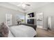 Comfortable main bedroom featuring a large window and a view into the ensuite bath at 82 Rising Fawn Ln, Marietta, GA 30060