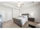 Tranquil main bedroom with a plush bed, side tables, and a stylish ceiling fan at 82 Rising Fawn Ln, Marietta, GA 30060