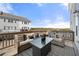 Inviting patio with cozy wicker furniture, patterned outdoor rug, and lovely view at 82 Rising Fawn Ln, Marietta, GA 30060