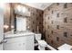 Stylish powder room with unique wallpaper, granite countertop, and modern fixtures at 82 Rising Fawn Ln, Marietta, GA 30060