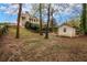 A large backyard with a playhouse and plenty of space to enjoy the outdoors at 1603 Pinder Point Dr, Lawrenceville, GA 30043