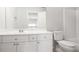 Bathroom featuring white vanity, mirror, toilet and shower at 1603 Pinder Point Dr, Lawrenceville, GA 30043