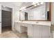 Bathroom featuring a dual sink vanity, framed mirror, and tile flooring at 1603 Pinder Point Dr, Lawrenceville, GA 30043