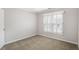 Bedroom with neutral carpet, window shutters, and white trim at 1603 Pinder Point Dr, Lawrenceville, GA 30043