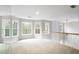 Bright bonus room with plush carpet and large windows offering an abundance of natural light at 1603 Pinder Point Dr, Lawrenceville, GA 30043