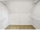 Walk-in closet with white shelving and carpeted floors at 1603 Pinder Point Dr, Lawrenceville, GA 30043