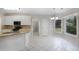 Eat-in kitchen with tile flooring, granite countertops, and bay window at 1603 Pinder Point Dr, Lawrenceville, GA 30043