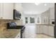 Bright kitchen with granite countertops, stainless steel appliances, and tiled floor at 1603 Pinder Point Dr, Lawrenceville, GA 30043