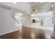 Open concept living room flows into kitchen with view of the upstairs balcony at 1603 Pinder Point Dr, Lawrenceville, GA 30043