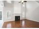 Spacious living room with fireplace, hardwood floors, and high ceilings at 1603 Pinder Point Dr, Lawrenceville, GA 30043
