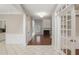 Open-concept home featuring hardwood floors, fireplace, and a view from the foyer at 1603 Pinder Point Dr, Lawrenceville, GA 30043