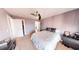 Comfortable bedroom with natural light, neutral tones, and ceiling fan at 7492 Shadburn Ferry Rd, Cumming, GA 30041