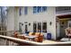 Inviting deck area with outdoor seating, views of the backyard and large windows at 7492 Shadburn Ferry Rd, Cumming, GA 30041
