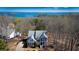 Inviting two-story house featuring a charming porch and scenic lake views at 7492 Shadburn Ferry Rd, Cumming, GA 30041