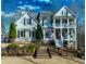 Charming two-story home featuring a double front porch and well-maintained landscaping at 7492 Shadburn Ferry Rd, Cumming, GA 30041