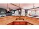 Modern kitchen features granite countertops, stainless steel appliances, and stylish pendant lighting at 7492 Shadburn Ferry Rd, Cumming, GA 30041