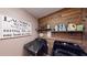 The laundry room offers modern machines and stylish decor with rustic wood accents at 7492 Shadburn Ferry Rd, Cumming, GA 30041