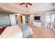 Spacious main bedroom featuring a fireplace, walk-out balcony, and neutral carpet at 7492 Shadburn Ferry Rd, Cumming, GA 30041