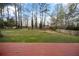 Expansive backyard with a wooden deck and perimeter fence, perfect for outdoor enjoyment at 1517 Cherry Hill Sw Rd, Conyers, GA 30094