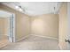 Finished basement with neutral colored walls, carpet, and a doorway at 1517 Cherry Hill Sw Rd, Conyers, GA 30094
