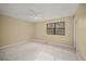 Cozy bedroom with neutral walls, a large window, and plush carpet flooring at 1517 Cherry Hill Sw Rd, Conyers, GA 30094