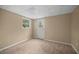 Versatile room with natural light, wood-look flooring, and access to the exterior through a door at 1517 Cherry Hill Sw Rd, Conyers, GA 30094