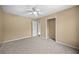Bedroom featuring neutral walls, plush carpeting, and closet for optimal storage space at 1517 Cherry Hill Sw Rd, Conyers, GA 30094