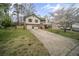 Split level home with neutral siding and an attached two-car garage at 1517 Cherry Hill Sw Rd, Conyers, GA 30094