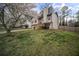 Charming home featuring a well-maintained lawn and blossoming tree in a suburban neighborhood at 1517 Cherry Hill Sw Rd, Conyers, GA 30094